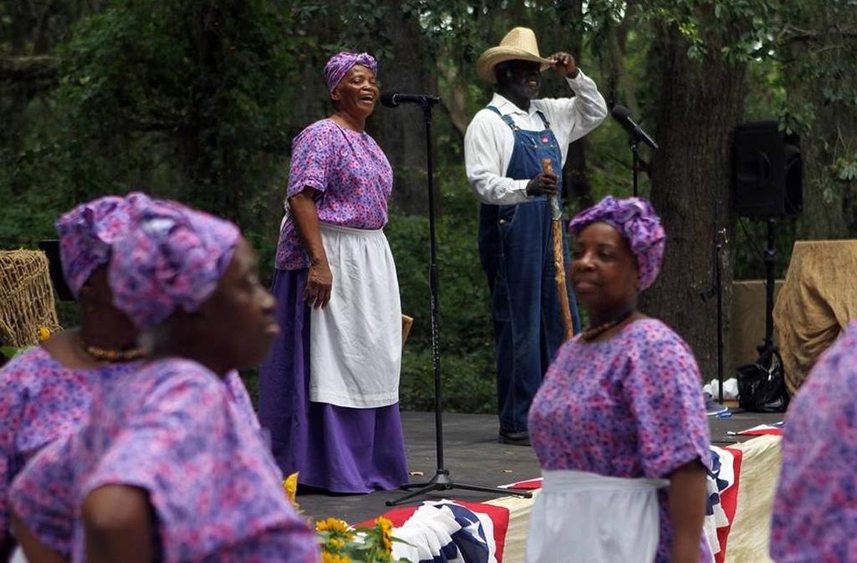 In this file photo from 2015, Joann Ross and Jack Evans sing a song on stage while the rest of the Geechee Gullah Ring Shouters dance during the Juneteenth Celebration hosted by the Mitchelville Preservation Project at Fish Haul Park on Hilton Head Island.