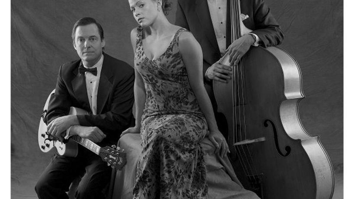 The Satin Doll Trio is Ken Kilpatrick on guitar, Fred Ferris on bass, and vocalist Patrice Ferris.