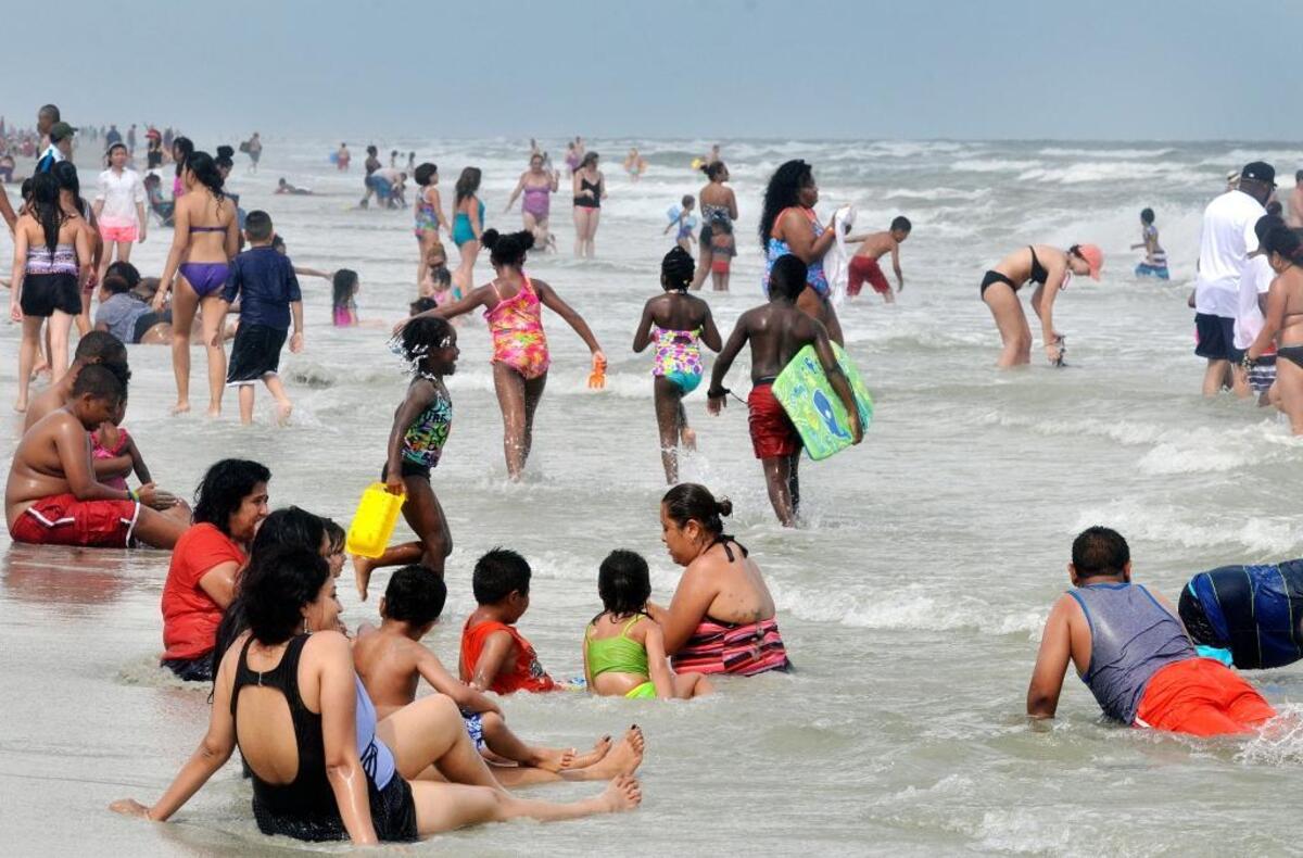 Beach-goers enjoy the sun and surf at Coligny Beach Park on Hilton Head Island.