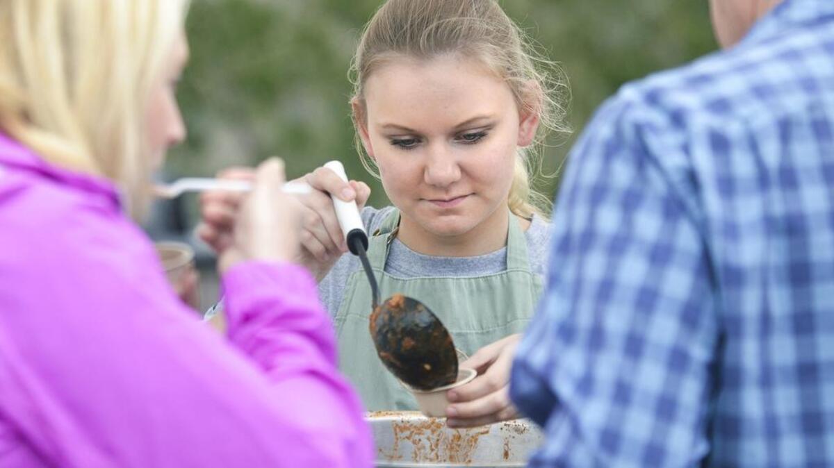 Anna Burke, spoons up some of the “medicinal chili” served by Burke’s Pharmacy during the 32nd annual Chili Cookoff, which was postponed to Jan. 21 by Hurricane Matthew. The 33rd annual event is set for Sept. 30.