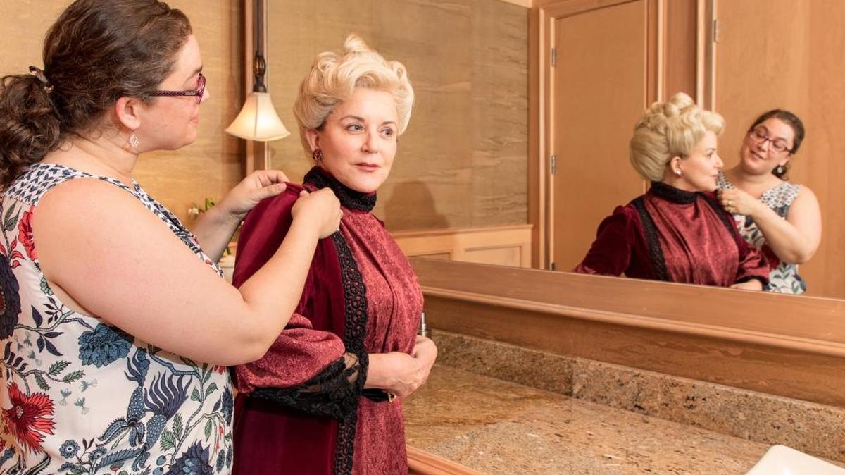 Costume designer Sarah McCaroll helps transform Mimi Wyche into Lady Bracknell in Lean Ensemble Theater’s production of Oscar Wilde’s "The Importance of Being Earnest."