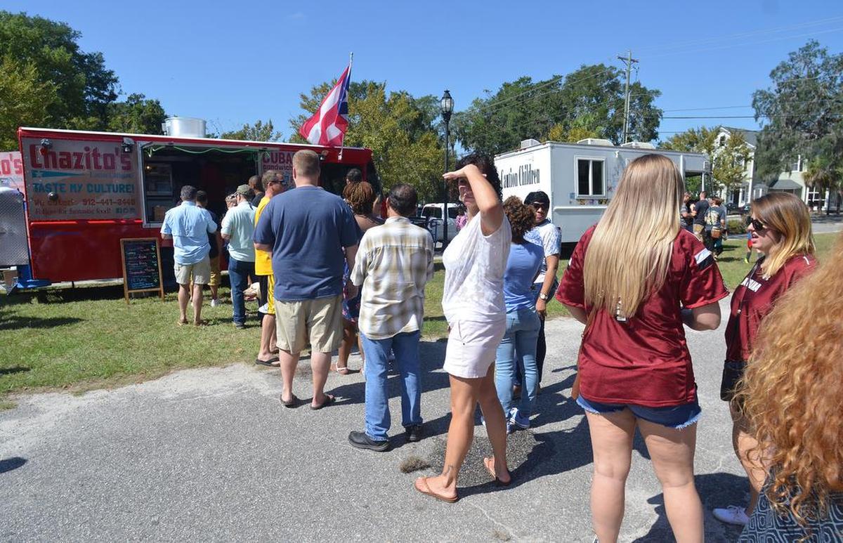 Customers wait to place their order at the Chazito's Latin Cuisine food truck during the inaugural Beaufort Food Truck Festival on Saturday at the Santa Elena Foundation. The lines were long, but the payoff was some tasty food truck food from a variety of purveyors -- and all for a good cause: proceeds from the event go to the Lowcountry Jaycees Camp Hope, which is a statewide residential camp for individuals with cognitive disabilities, ages 7 and older.