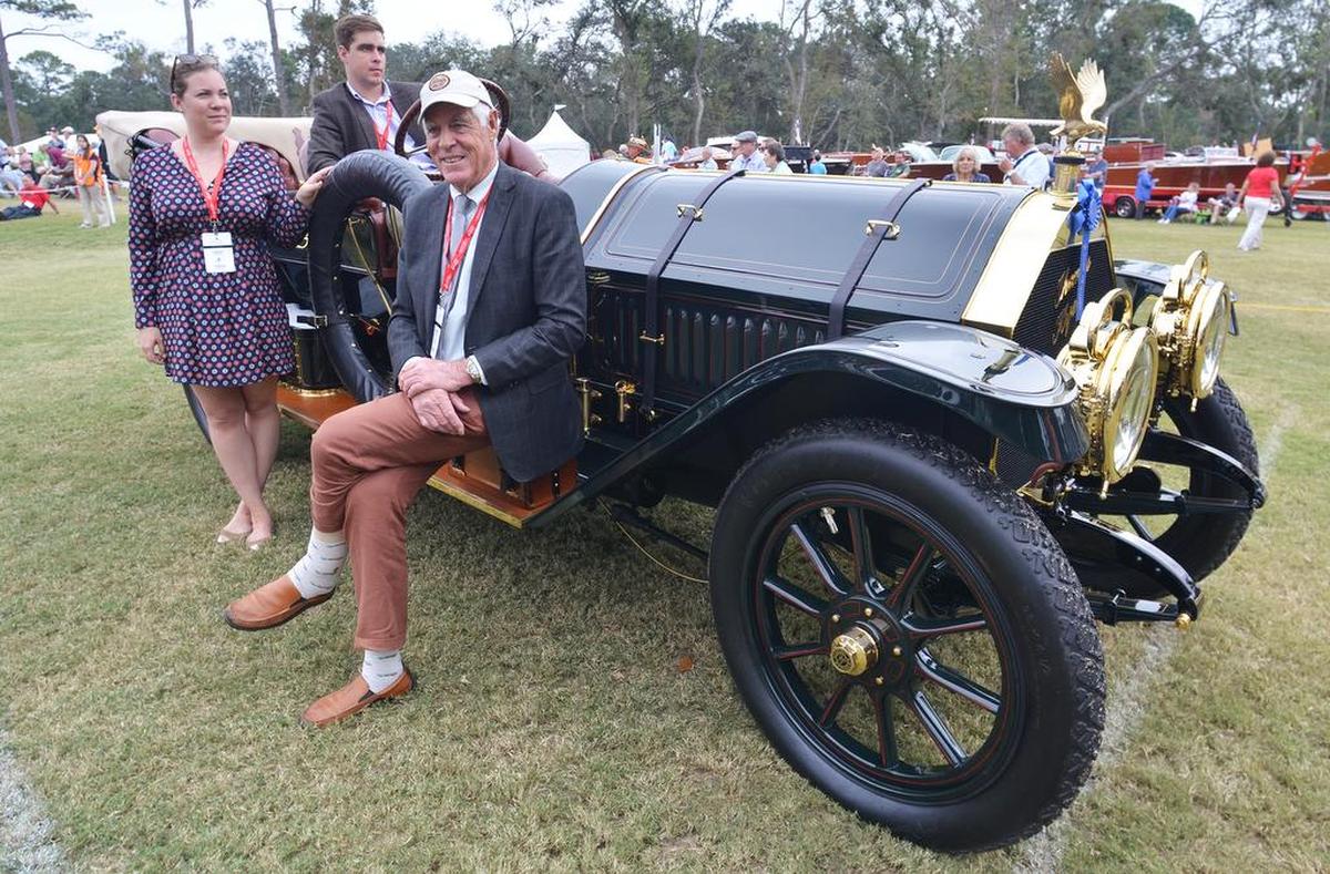 Jim Grundy, of Horsham, Pa., along with his daughter, Gwendalyn, and son, Josh, sit with their 1910 Thomas 670 Flyabout at the Concours d’Elegance on Sunday.
