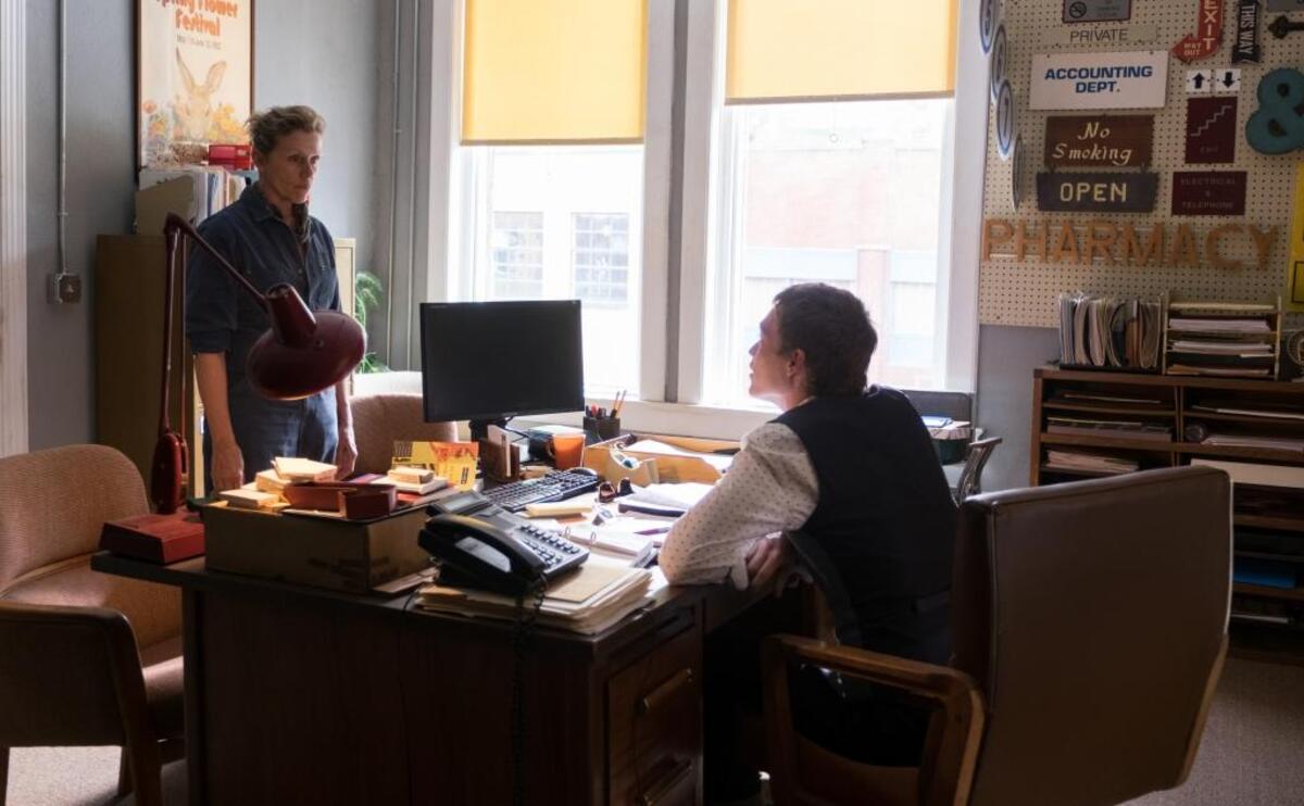 Bluffton resident Lillian Byrne Heyward designed the poster behind Frances McDormand in this shot from “Three Billboards Outside Ebbing, Missouri.”