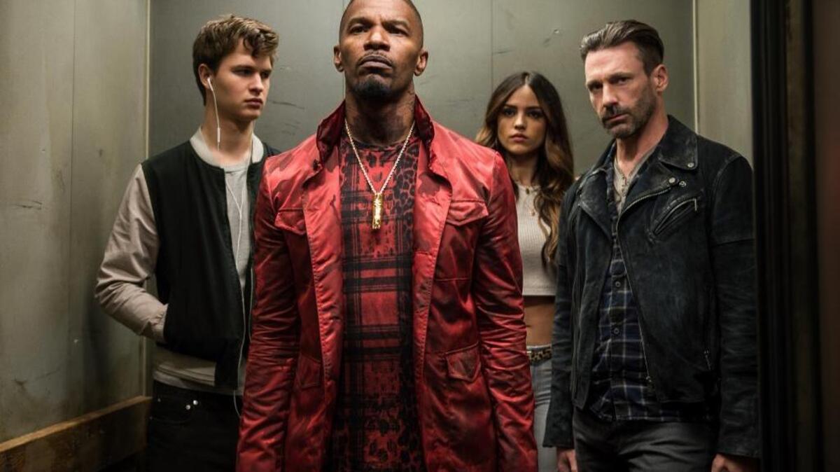 From left, Ansel Elgort, Jamie Foxx, Eiza Gonzalez and Jon Hamm star in a scene from “Baby Driver.”