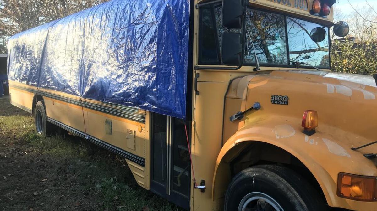 We found out the hard way that our bus isn’t waterproof. Here it is draped in a big blue tarp to stop the leaks.