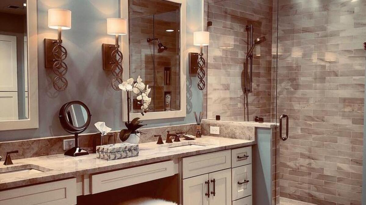 This lovely new owners’ suite bath is bright and spacious after the renovation. Rather than replacing the old bathtub the homeowners chose instead to have a large shower to provide a spa-like oasis and retreat.