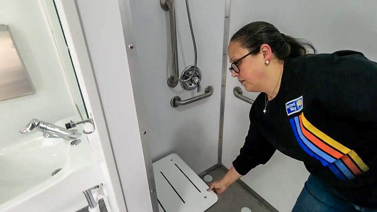 The pull down chair in the ADA compliant restroom as displayed by Angela Boswell, community impact manager for the United Way of the Lowcountry at the non-profits office on Feb. 20, 2025, in Beaufort.