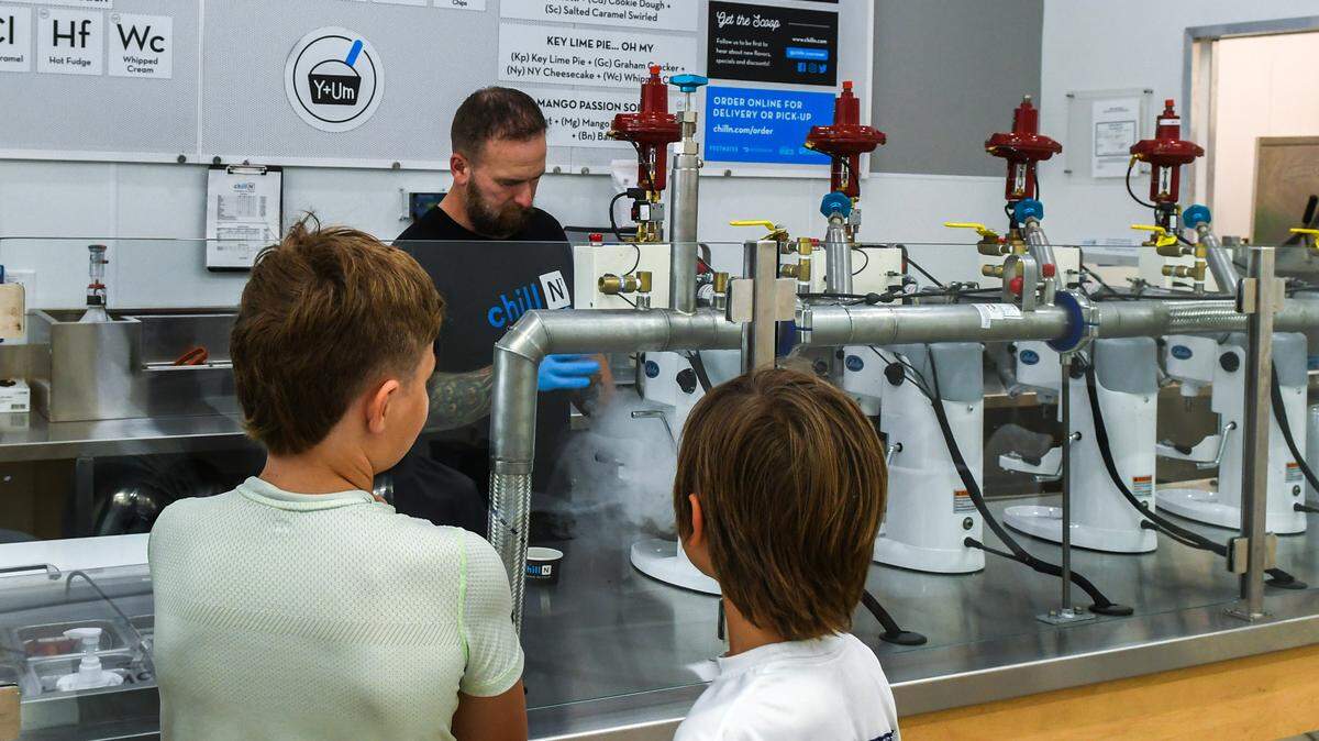 Young customers watch as franchise owner Derek Cohen uses nitrogen to make their ice cream on Thursday, June 20, 2024 at Chill-N Nitrogen Ice Cream, located at 65 Towne Drive in Bluffton. Nitrogen is an odorless, tasteless and non-toxic gas that flash-freezes either ice cream or yogurt at 320 degrees below Fahrenheit.