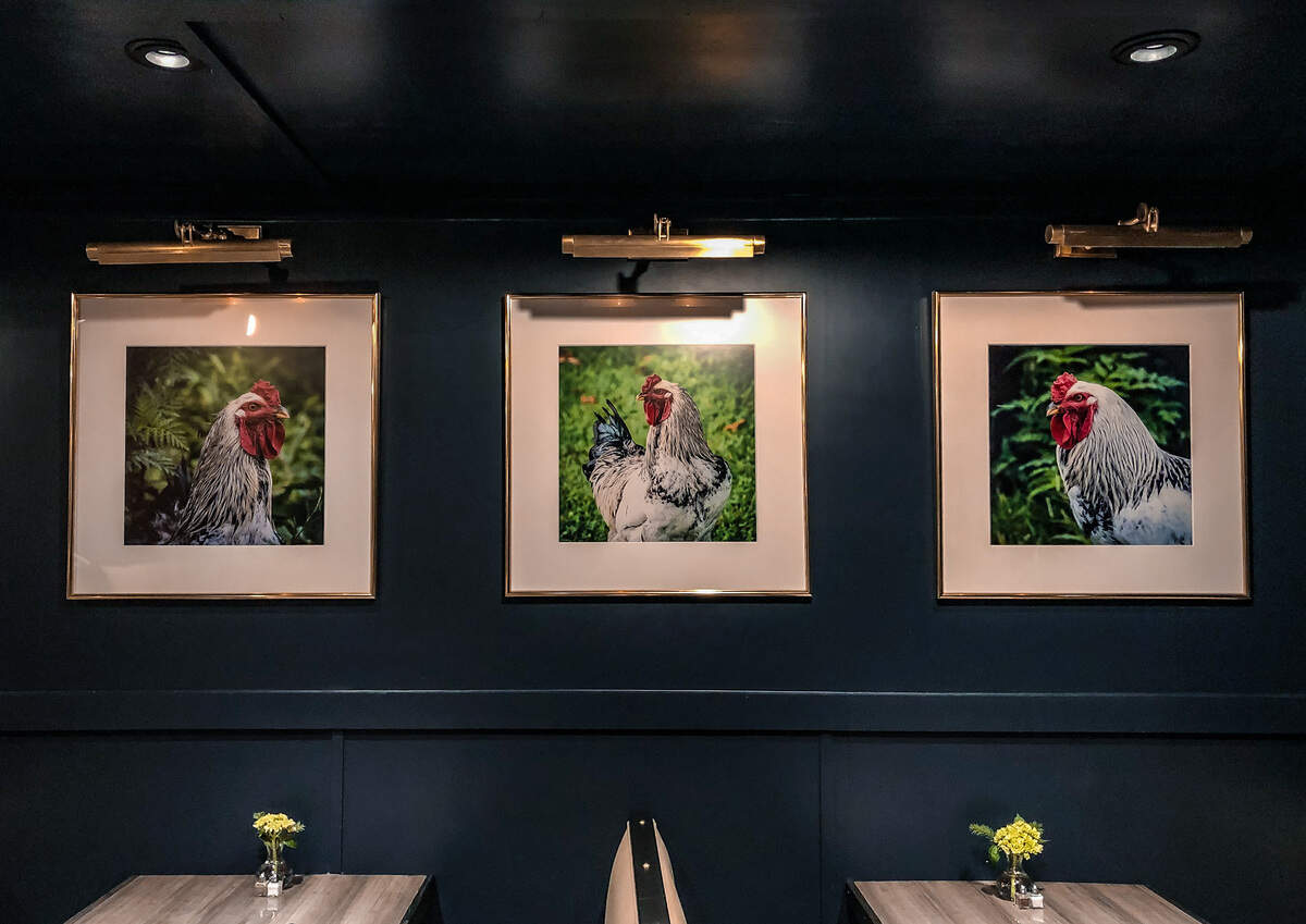 Photographs by Hilton Head artist Kathryn Ramseur line one wall of the dining room.