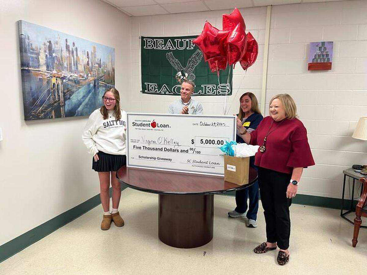From left to right, Caroline O’Kelley, sister and sophomore at BHS, Arthur O’Kelley, dad, English O’Kelley, mother, and Jennifer Van Cleave, outreach manager with the SCSLC, stand around to surprise and congratulate senior Virginia O’Kelley with her scholarship award.
