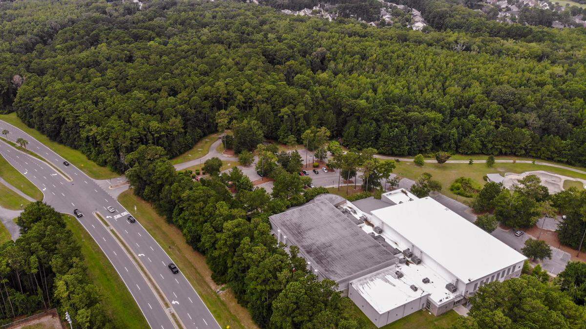 Three baseball fields, batting cages and a press box were planned for the forested area of the Buckwalter Recreation Center -- its main building pictured -- as seen on Thursday, Aug. 11, 2022, located along Buckwalter Parkway in Bluffton. Wetlands are now scaling back development plans by about 22 acres for the Beaufort County land. Two lighted soccer fields with parking are being proposed.