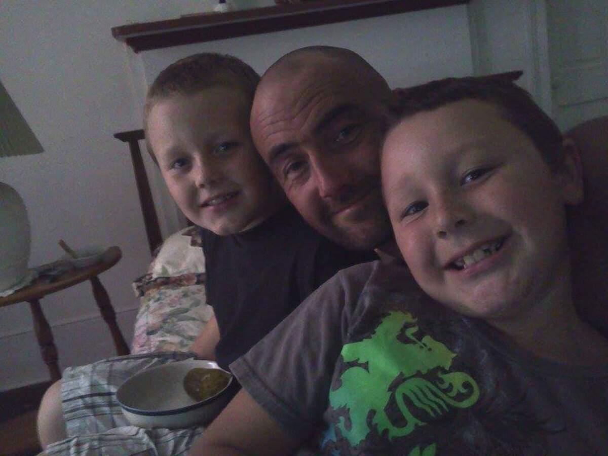 Adam Wesley Crow, who died in an Aiken County jail in 2017 at the age of 36, is pictured with his two sons, Adam Jr. and Nathaniel.