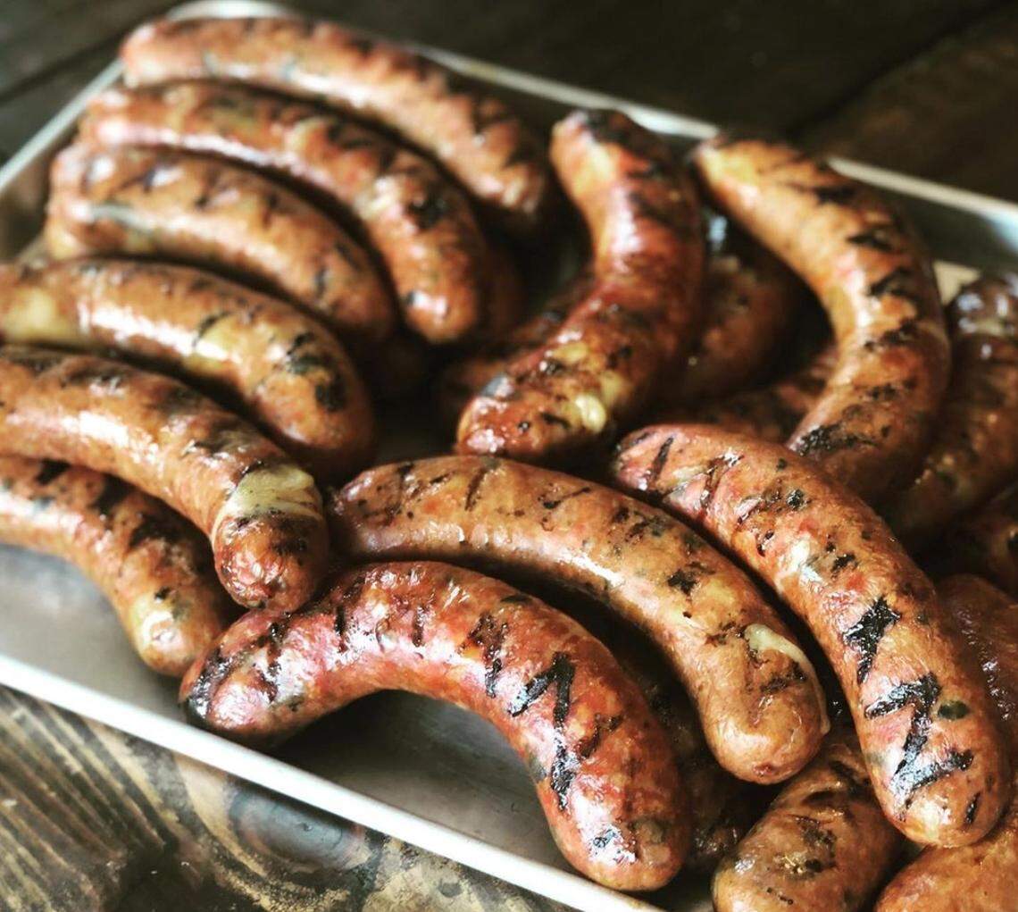 Malone Barbecue’s homemade sausage is made with fire-roasted poblano peppers and pepper jack cheese.