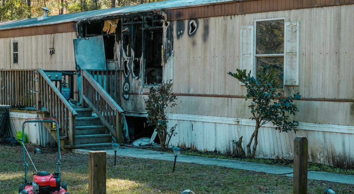 In this photo taken on Nov. 30, 2021, a couple escaped a fire on Saturday morning in this mobile home in the 500 block of Joe Frazier Road in Burton.