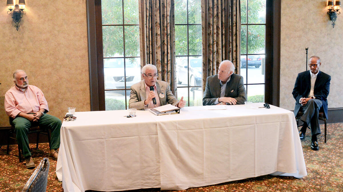 Moderator Larry Hughes, second from right, listens as Bluffton Town Council candidates, from left, Ted Huffman, Harry Lutz and Dan Wood speak during a candidate forum at Hampton Hall on Nov. 14 leading up to a runoff election Nov. 17. Lutz and Wood won the two open seats.