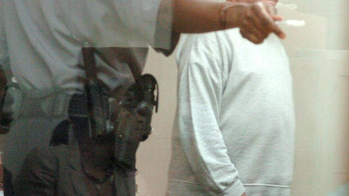 Richard Santee enters the courtroom for his bond hearing at the Beaufort County Detention Center on Wednesday morning. He was released on a $10,000 bond and had to forfeit his passport and gun collection.