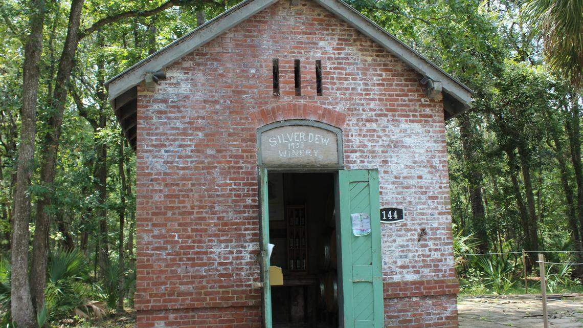 Originally constructed in 1883 to store oil for the lighthouse lamps, the brick wick house was converted into a winery in the mid-1900s by Pappy Burn, who made a name for himself with his scuppernong wine.