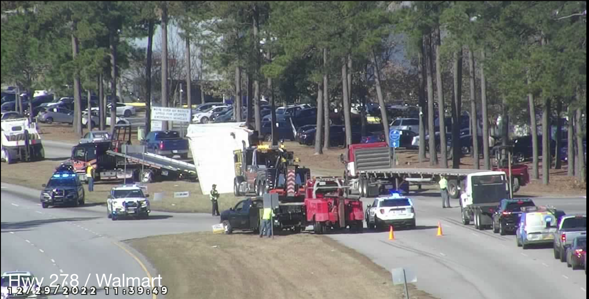 A number of tow trucks respond to the scene Thursday morning after a mobile home flipped onto U.S. 278 in Hardeeville.