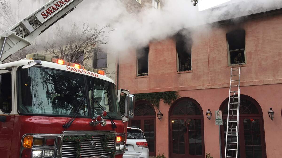 Smoke billows from the second floor of The Olde Pink House restaurant after a morning blaze Thursday, Dec. 27, 2018, in downtown Savannah.