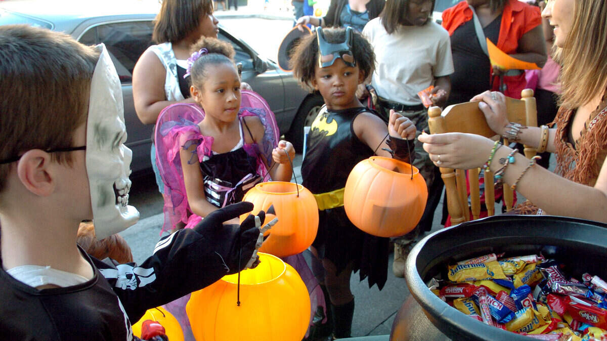 Children line up to collect some treats during the 2009 Trick-or-Treat in Downtown Beaufort event, presented by Main Street Beaufort, USA, and area merchants.