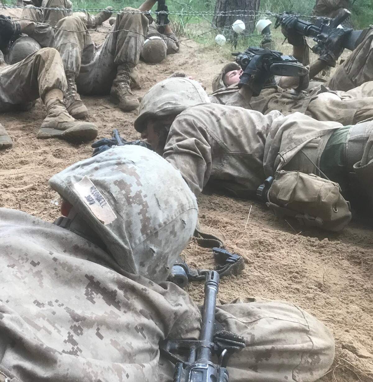 James Tucker McConnell and other trainees with Platoon 3072 negotiate a barb-wire obstacle during The Crucible on Friday, Sept. 21, 2018, at Marine Corps Recruit Depot Parris Island, S.C.