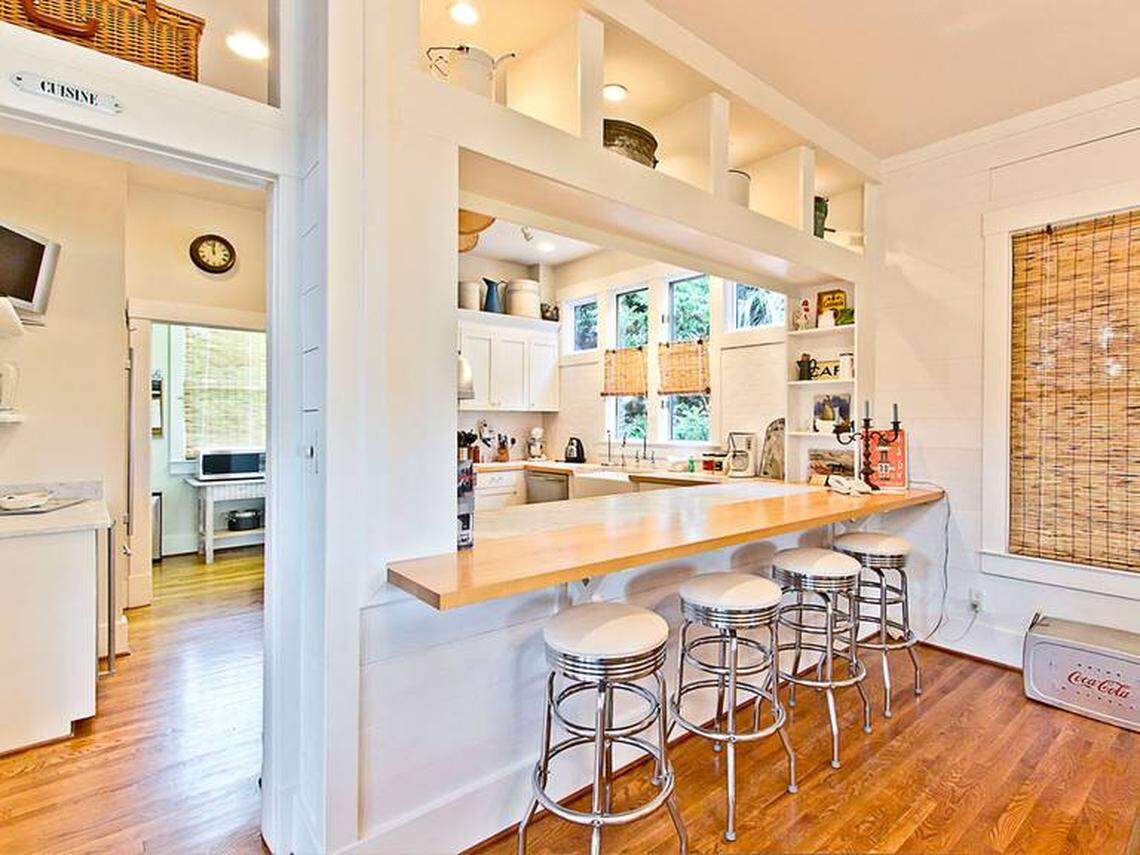 Barstools offer a place for eating or visiting just off the kitchen.