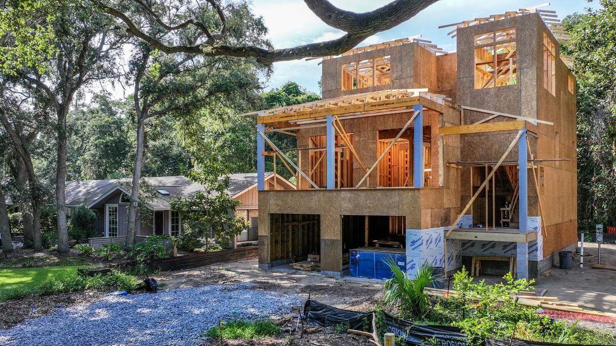 Three undeveloped lots once covered in thick and leafy underbrush and majestic live oaks are now being developed by one owner into three-story single family homes in the Holiday Homes neighborhood. Some residents are concerned that their neighborhood, made up primarily of single-story ranch style homes, will lose its charm and become a mecca for short term rentals. The homes were photographed on July 29, 2025, on Hilton Head Island.