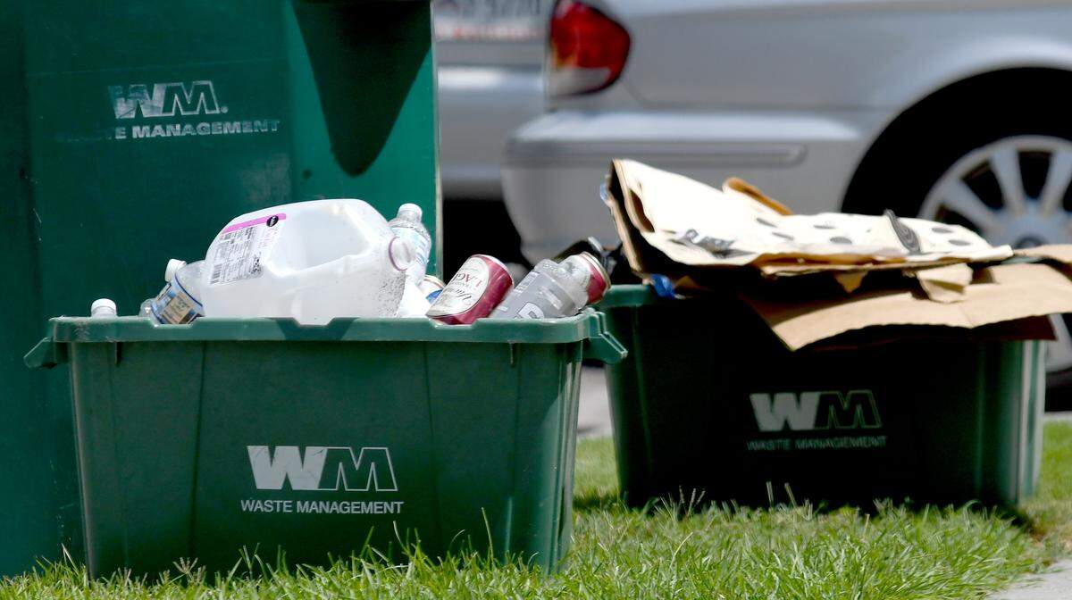 Recyclables are put out with the trash on Tuesday for colletion along Pinecrest Drive in Bluffton's Pinecrest neighborhood. Waste Management does not accept Styrofoam, plastic bags or materials contaminated with food waste, for example, a cardboard pizza container.