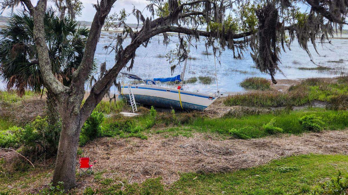 In September, Tropical Storm Helene ripped numerous boats from their moorings and several, including this one, remain grounded on the bank of the Beaufort River as photographed on April 3, 2025, in downtown Beaufort.