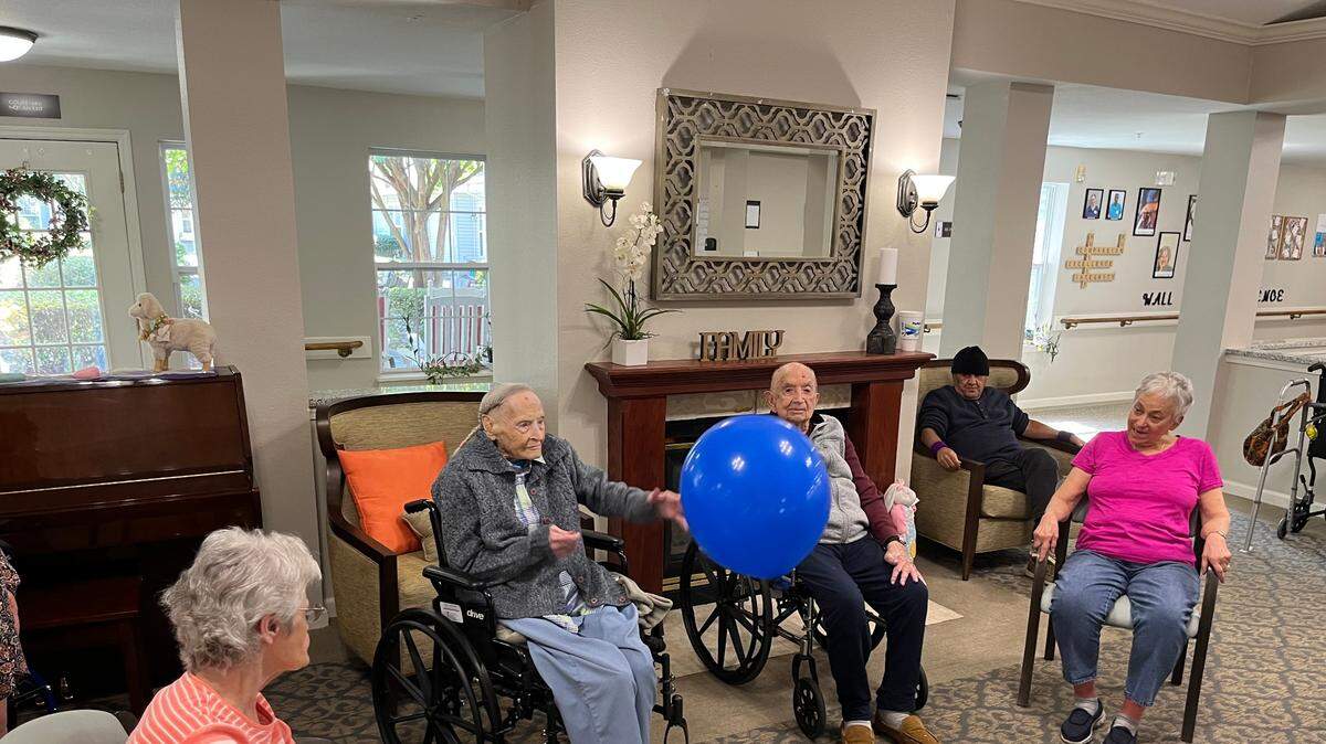 Eutelle Nix keeps a ball in play at the Helena Place Senior Living in Port Royal earlier this week as residents, including Bill Stultz, immediately to her right, participate in morning exercise. Nix will be 110 Friday. Stultz will be 103 Tuesday.