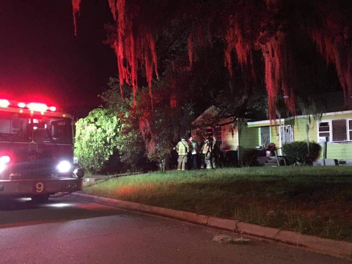 A Savannah teen rescued his neighbor from this house after an air-conditioning unit caught fire in the elderly man’s bedroom on Monday night.
