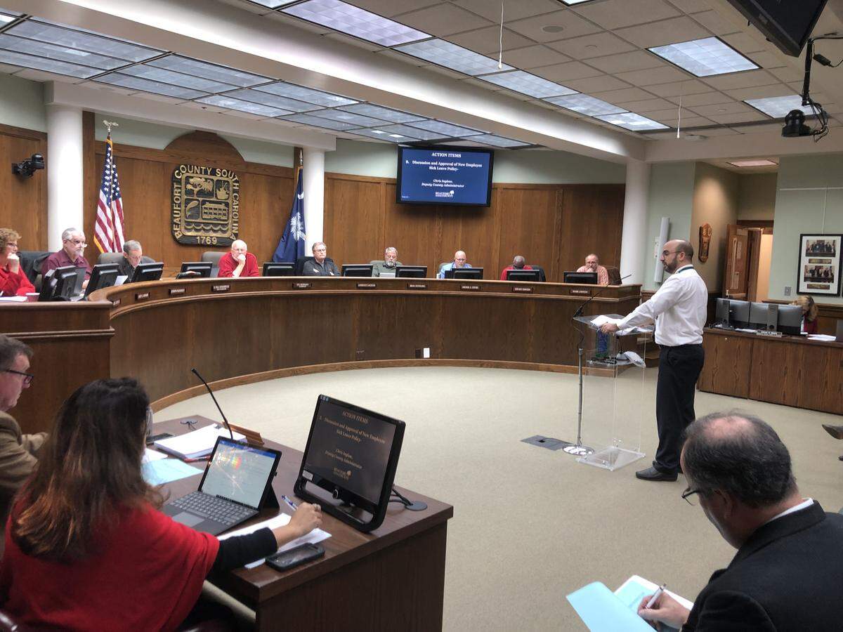 Deputy County Administrator Chris Inglese presents a plan to provide county employees with paid sick leave and three additional paid holidays to the finance committee on Dec. 2.