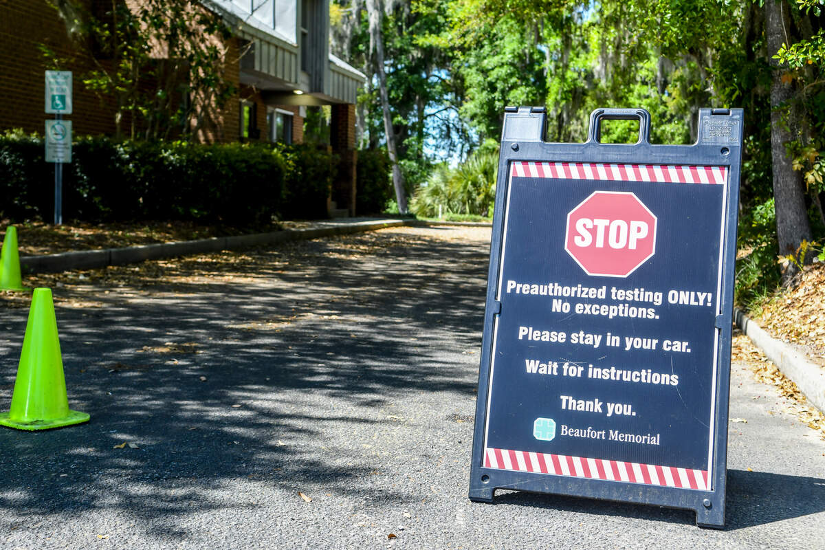 A sign informs patients to wait in their cars until it is determined through questions if they should continue to the swabbing area of Beaufort Memorial Hospitals Express Care as seen in this photo taken on Friday, April 3, 2020, located on Ribaut Road in Beaufort.