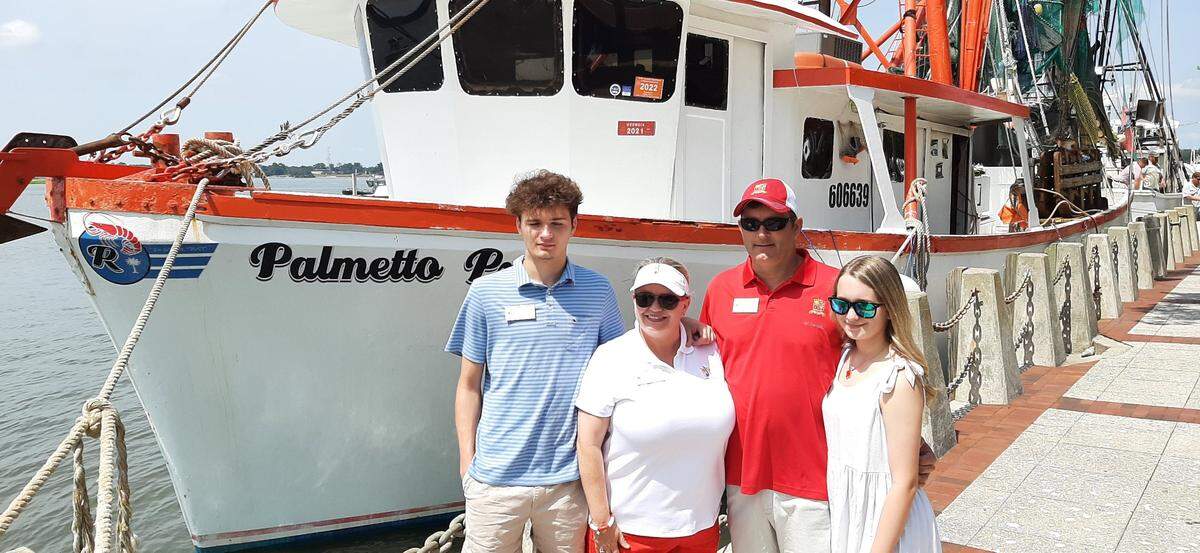 Shawna Doran, the new Beaufort Water Festival commodore, joins son Colton, husband Brett and daughter Ava before boarding the Palmetto Pride for the annual fleet blessing and boat parade Sunday, July 25, 2021.