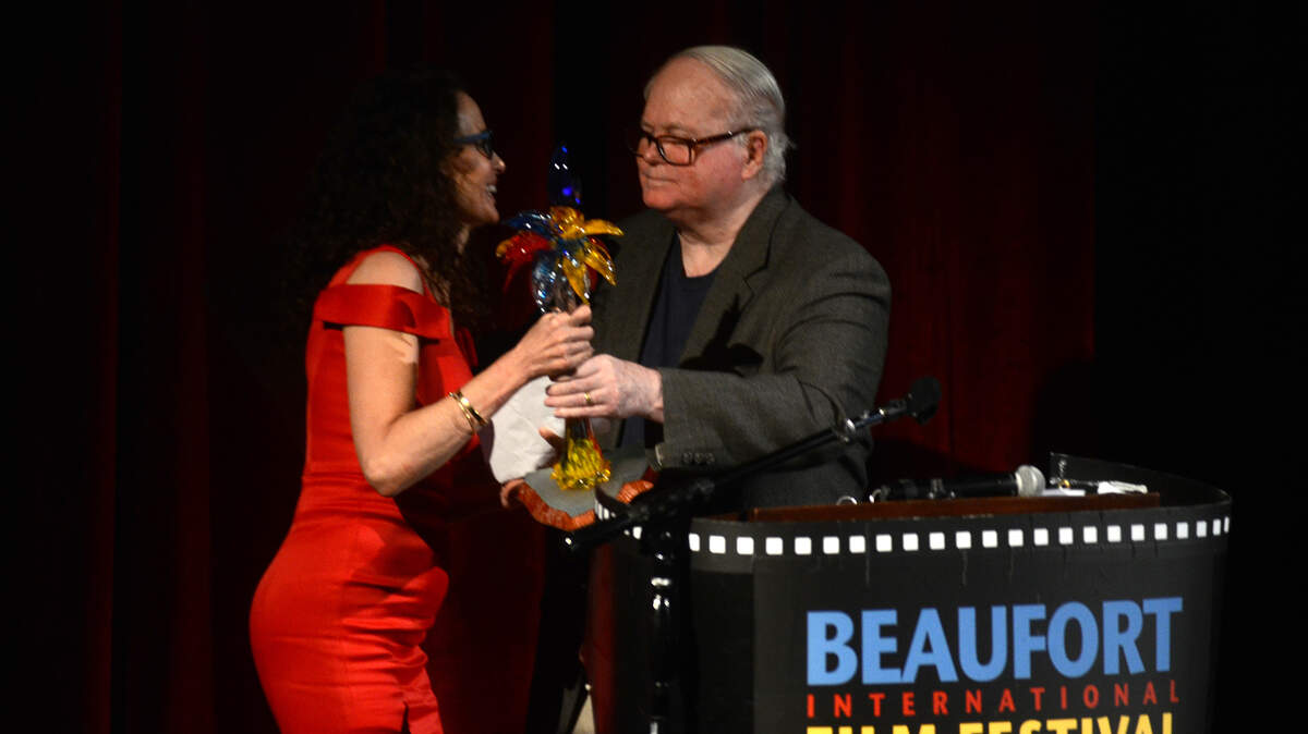 Author Pat Conroy, right, hands the Spirit & Pride of South Carolina Award to actress Andie MacDowell during the 9th annual Beaufort International Film Festival awards ceremony the evening of Feb. 14, 2015, at the University of South Carolina Beaufort Center for the Arts in Beaufort.
