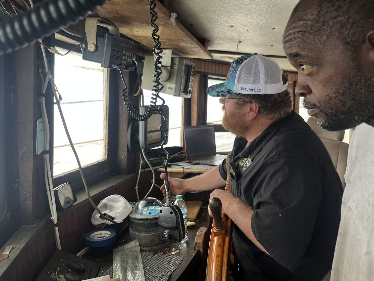 Rodney Brown and Craig Reaves in the pilot house as the Gracie Bell heads for St. Helena Sound for a day of hunting white shrimp.