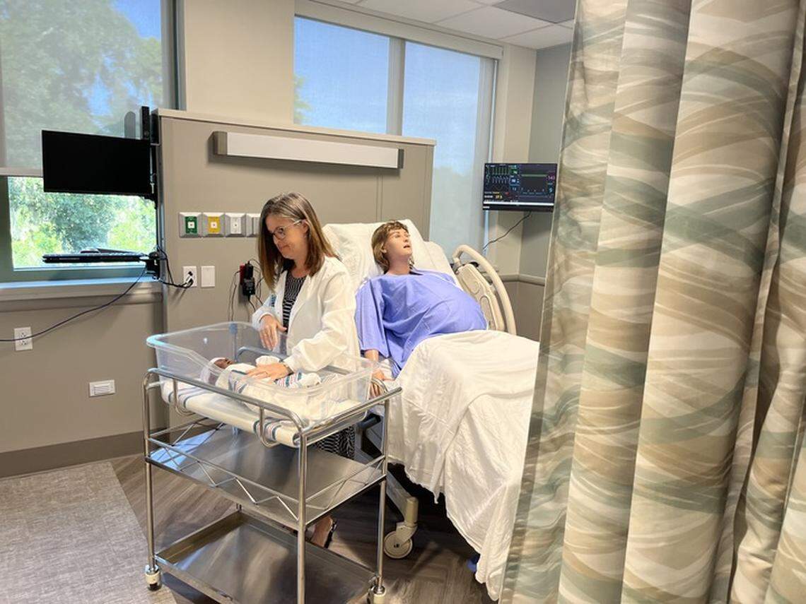 Clinical instructor Paige Thompson works with Newbee, a newborn manikin with artificial intellegence, at a new training center at Beaufort Memorial Hospital.