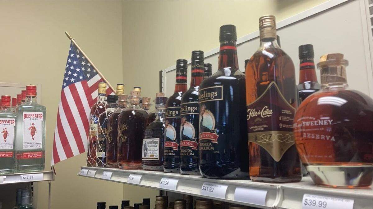 Liquors line the shelves of a private liquor and wine store.