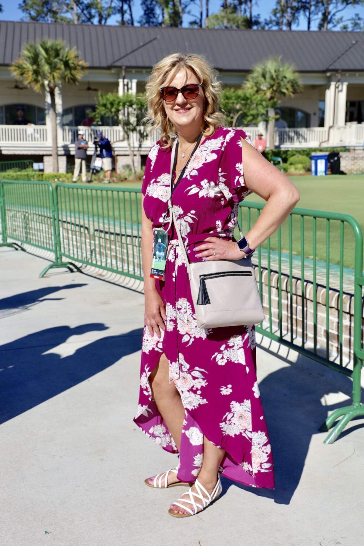 Kelly Cook is visiting Heritage for the first time and looks incredible in her magnenta dress! Her nude-tone purse pairs perfectly with her strappy white sandals. Kelly kept the emphasis of her outfit on her dress and was able to do so by using subtle colors for her shoes and purse.