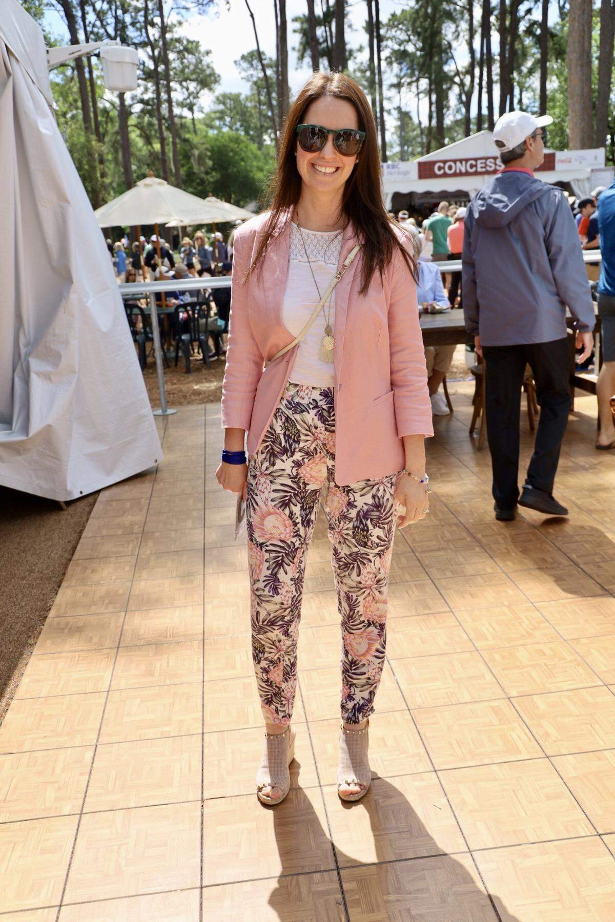 Mirna Tomic of Hilton Head Island stands out in the crowd in one of my favorite outfits so far this year. Her pink blazer and floral-print pants make the perfect suit outfit. Using gold accessories and nude heels, Mirna’s outfit continues the pastel color trend.