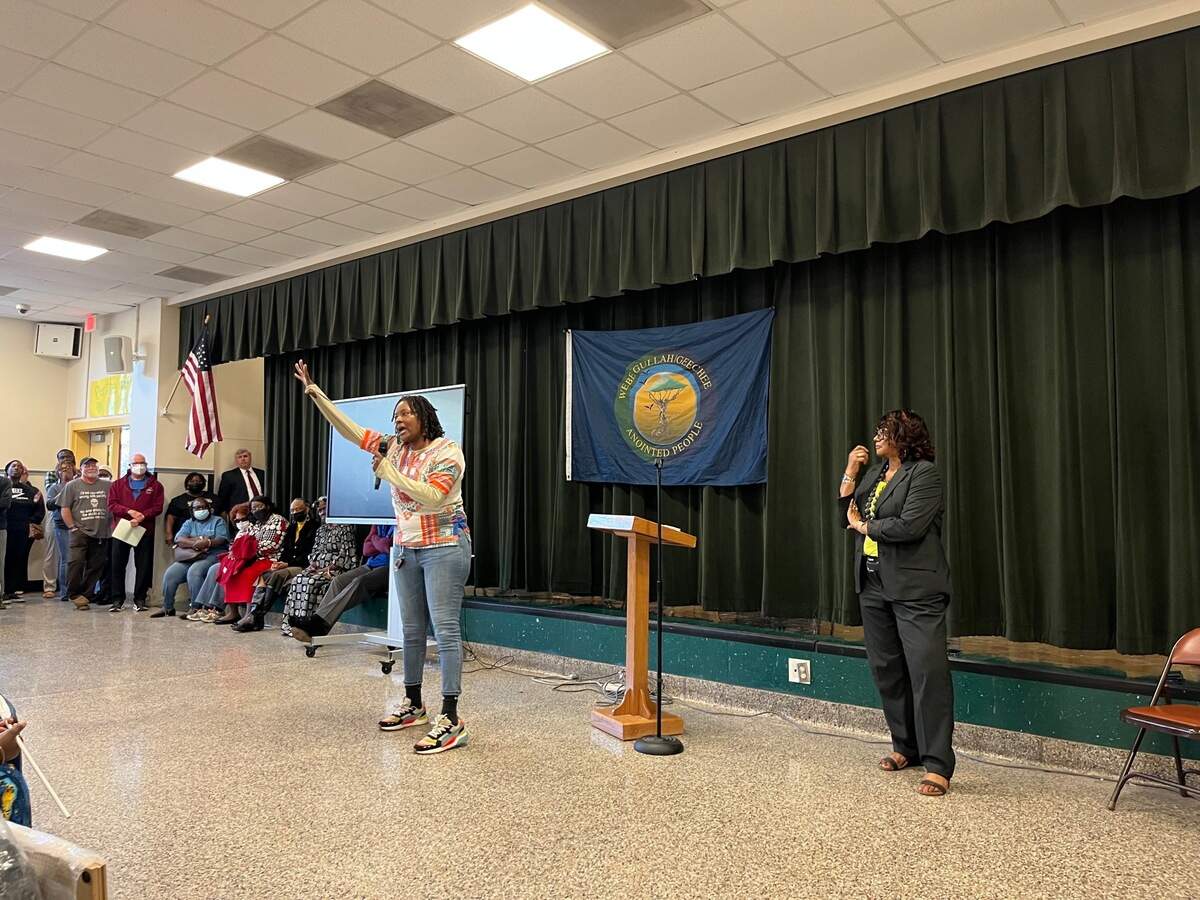 Natasha Robinson speaks during a rally against a proposed golf and housing development Thursday at St. Helena Elementary School.