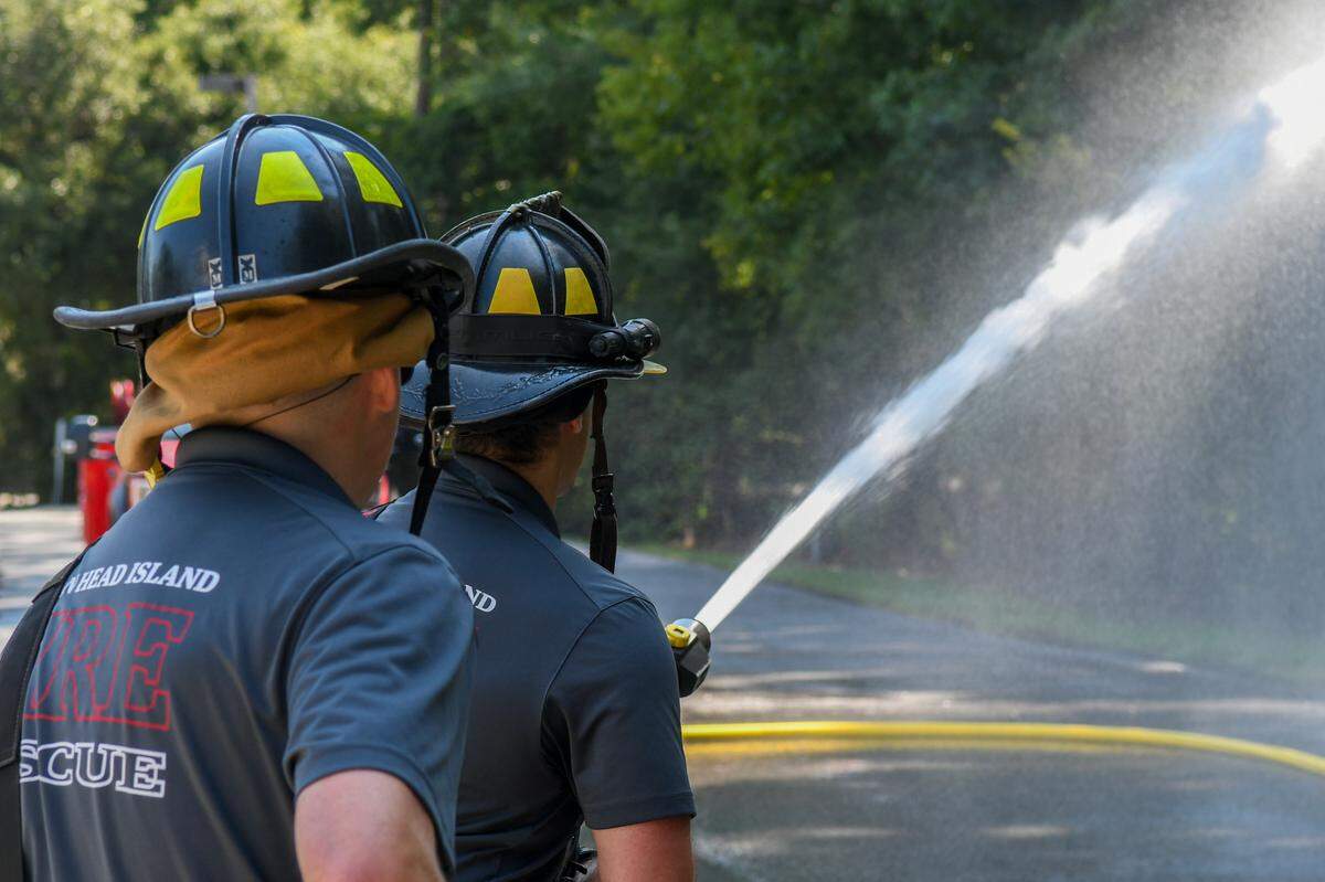 Firefighters with Hilton Head Island Fire Rescue get acquainted with the new pressurization of the new custom designed KME pumper truck that can dispense 1,500 gallons a minute on Aug. 1, 2024 at headquarters on Hilton Head.