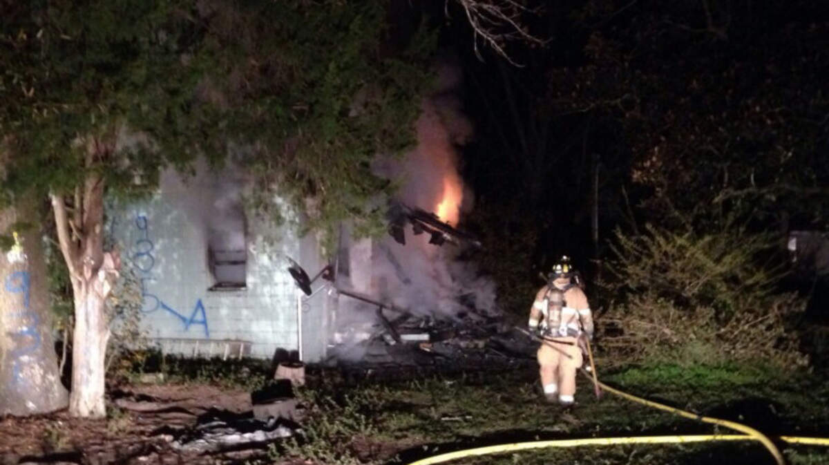 Lady's Island-St. Helena Fire District firefighters work to control a fire that destroyed a Sams Point Road home.