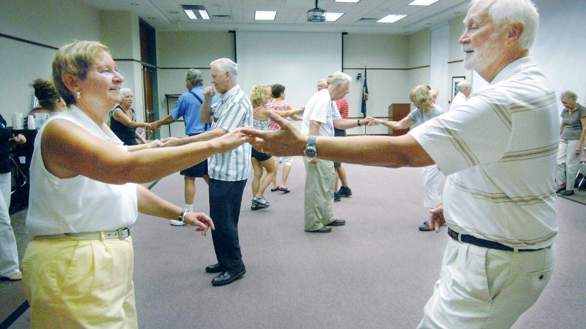 "We're masters of shag!" said Jan Schuda, left, as she and her husband, Steve, got the hang of the state dance of South Carolina during an introductory class at the Hilton Head Island branch of the Beaufort County Library on Monday afternoon.
