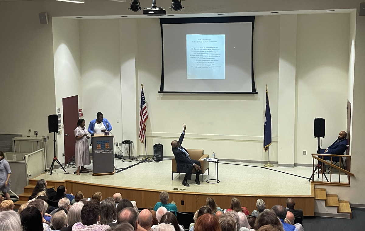 South Carolina Congressman points to a copy of the 14th Amendment of the United States Constitution during his two-hour town hall, held at the Technical College of the Lowcountry in Beaufort on April 24, 2025.