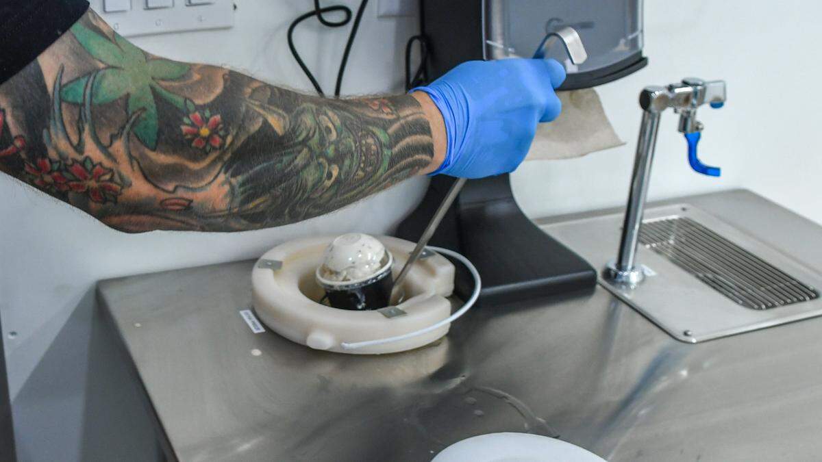 Chill-N Nitrogen Ice Cream franchise owner Derek Cohen demonstrates a dunk tank filled with nitrogen that can refreeze ice cream for the ride home without any change to its flavor. Chill-N Nitrogen Ice Cream is located in Belfair Towne Village in Bluffton.