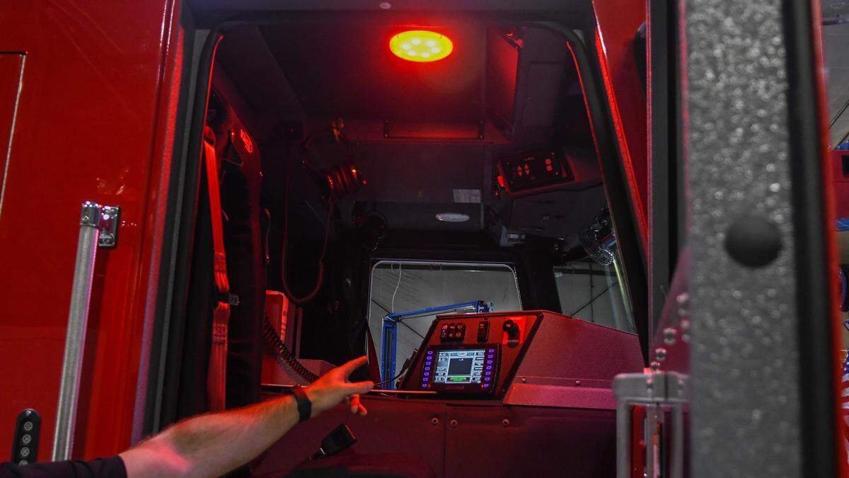 Hilton Head Island Fire Rescue Deputy Fire Chief Justin Cunningham explains how cabin lighting converts to red in the evening that allows firefighters to keep their night vision on Aug. 1, 2024 in the service bay at headquarters on Hilton Head.