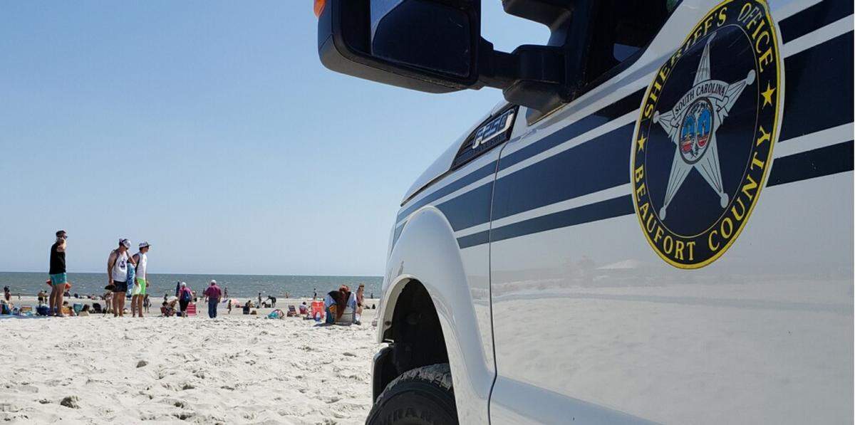 A press release from the Beaufort County Sheriff’s Office alerted Hilton Head Island beach goers on Friday, March 20, 2020, of S.C. Gov. Henry McMaster’s executive order banning a groups of 50 people or more due to the COVID-19 virus. A deputy sheriff truck was parked at Coligny Beach Park’s entrance as deputies monitored beach groups using an all-terrain vehicle.