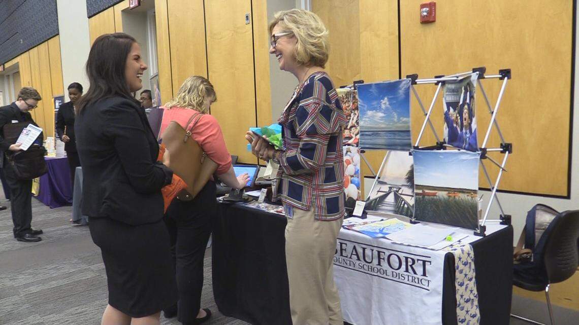 Beaufort County School District talent acquisition specialist Jill McAden at a recent recruiting fair to interview and hire teachers for the 2018-19 school year. McAden displays photos of the Lowcountry at her booth.